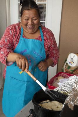 2-MOIFA-Gallery of Conscience : Beverly Billie of Tewa Women United cooks fry bread for the group before an art therapy workshop, San Ildefonso Community Center, April 12th, 2018    Photographer: Chloe Accardi    