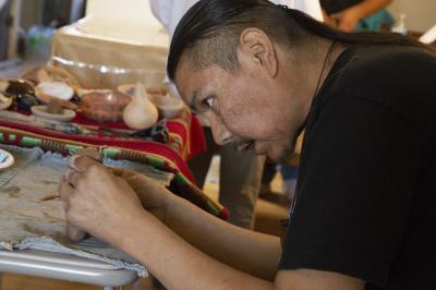 2-MOIFA-Gallery of Conscience: Wayland Sanchez sculpting his clay piece during a healing pottery workshop at Elder Kathy Wan Povi Sanchez’ house, San Ildefonso Pueblo, April 10th, 2018    Photographer: Chloe Accardi 