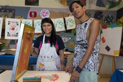 2-MOIFA-Gallery of Conscience ::Carol Fernandez and Fernando Castro of Amapolay at the Street Art and Activism screen printing workshop at MOIFA, June 26th, 2018   Photographer: Chloe Accardi 