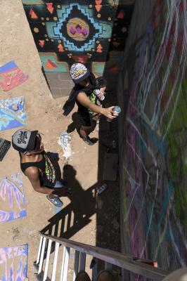 2-MOIFA-Gallery of Conscience : Carol Fernandez and Fernando Castro of Amapolay  painting at artist collective Alas de Agua’s mural site in Santa Fe, June 27th, 2018   Photographer: Chloe Accardi   